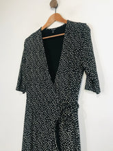 Load image into Gallery viewer, Baukjen Women&#39;s Polka Dot Midi Wrap Dress | UK14 | Black
